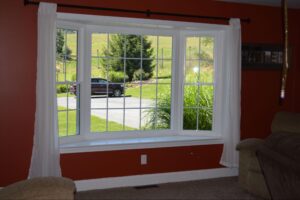 Bay window with curtains on either side